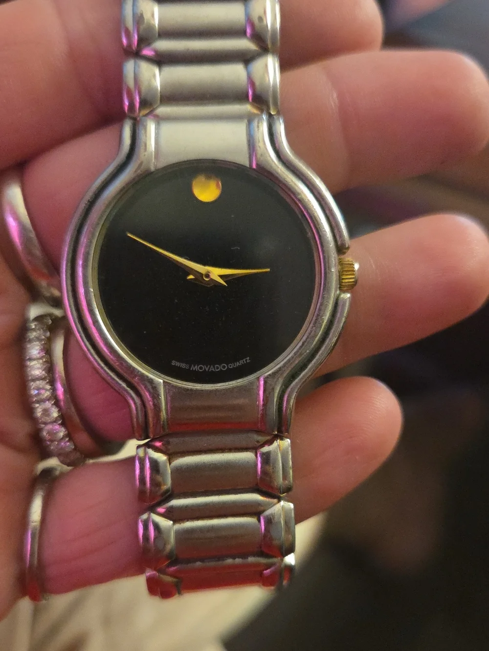 Movado Black Dial Watch with Gold Hands and Dot